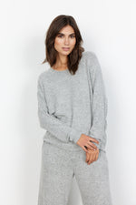 Load image into Gallery viewer, A female model wearing a grey, long-sleeved SOYACONCEPT blouse with a round neckline and elastic ripped edge at the cuffs.