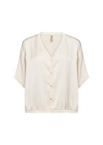 Load image into Gallery viewer, Cream tee that features a smooth texture with short sleeves, a V-neckline, and buttons down the front.