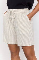 Load image into Gallery viewer, A model wearing mid-rise beige shorts with a pinstripe print and an adjustable waistband.
