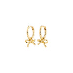 Load image into Gallery viewer, Gold hoop earrings with bow charms on a white background