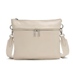 Load image into Gallery viewer, Off white vegan leather crossbody with multiple zippers on a white background