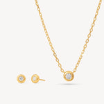 Load image into Gallery viewer, Gold bezel necklace and earrings set on a white background