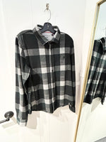 Load image into Gallery viewer, Olive and grey checkered shirt on a hanger with a mirror reflection.