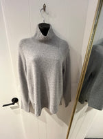 Load image into Gallery viewer, Grey turtleneck sweater with rib detail on cuffs, bottom hem, and neck.