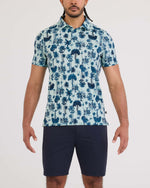 Load image into Gallery viewer, Man wearing a blue tropical pattern shirt and navy shorts on a white background