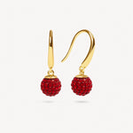 Load image into Gallery viewer, Gold earrings with red gemstones on a white background