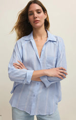 Load image into Gallery viewer, Woman wearing a light blue striped shirt against a plain background