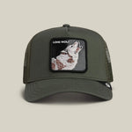 Load image into Gallery viewer, Green trucker cap with a wolf patch labeled 'Lone Wolf' on a beige background
