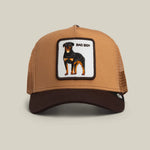Load image into Gallery viewer, Brown trucker cap with a dog patch and 'Bad Boy' text on a beige background
