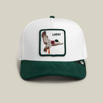 Load image into Gallery viewer, White and green cap with a duck patch and 'LUCKY' text on a beige background
