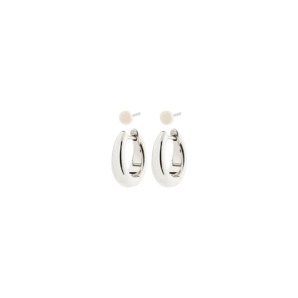  2-in-1 earring set combining classic freshwater pearl stud earrings with small, chunky huggie hoops in a shiny  silver-plated finish. 