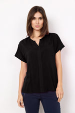 Load image into Gallery viewer, Woman wearing a black short-sleeve top against a white background
