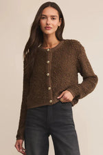 Load image into Gallery viewer, Woman wearing a brown textured sweater with buttons on a beige background
