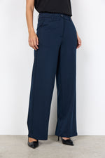 Load image into Gallery viewer, Navy blue wide-leg pants worn by a person against a white background
