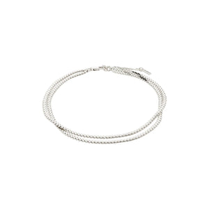Ankle bracelet featuring two flat snake chains, also known as Herringbone chains, in silver. 