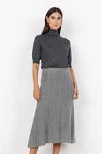 Load image into Gallery viewer, Grey skirt with a ribbed waistband and a textured fabric that reaches mid-calf length. 
