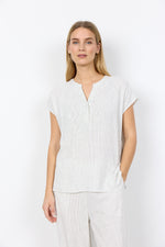 Load image into Gallery viewer, Woman wearing a white striped shirt and pants on a plain background
