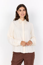 Load image into Gallery viewer, Woman wearing a white blouse with lace collar against a white background
