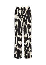 Load image into Gallery viewer, Black and white patterned pants on a white background
