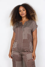 Load image into Gallery viewer, Woman wearing a brown and white striped outfit on a white background
