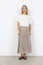 Load image into Gallery viewer, Woman wearing a white top and checkered midi skirt against a white background
