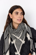 Load image into Gallery viewer, Woman wearing a black and white patterned scarf on a white background
