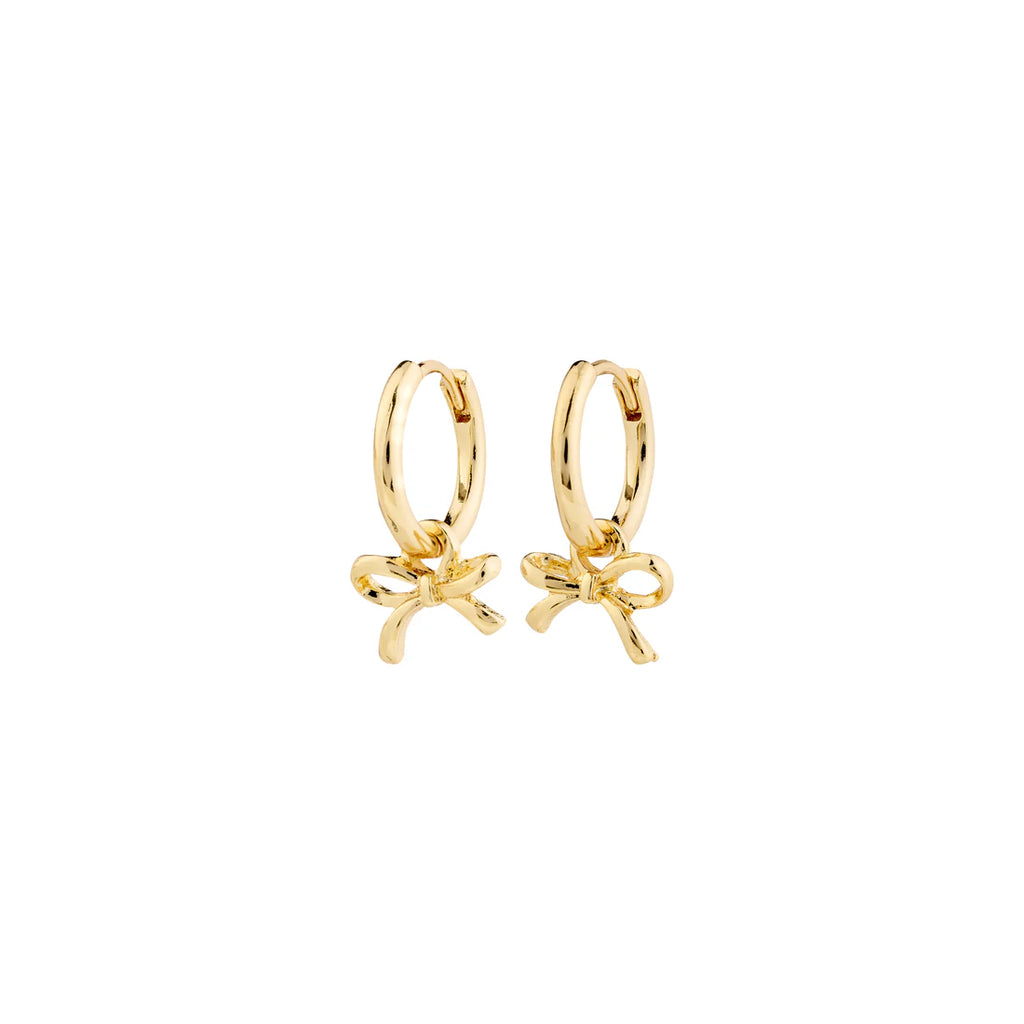 Gold hoop earrings with bow charms on a white background