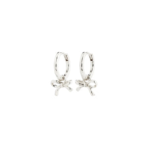 Silver hoop earrings with bow details on a white background
