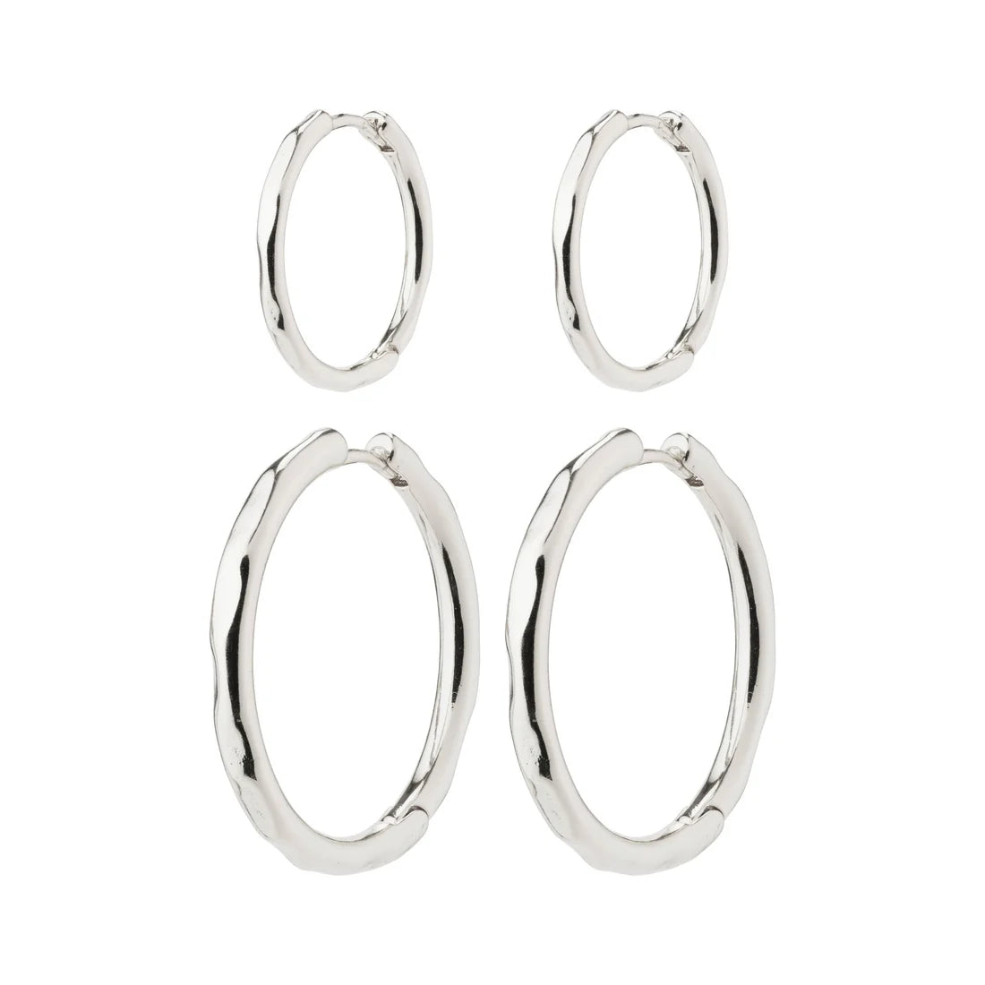 Set of silver hoop earrings on a white background. Huggie closure. 