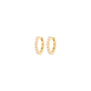 Gold pearl hoop earrings on a white background