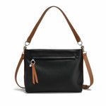 Load image into Gallery viewer, Black handbag with brown straps on a white background
