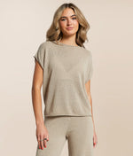 Load image into Gallery viewer, Woman wearing a beige knit top and pants on a beige background
