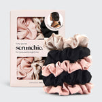Load image into Gallery viewer, Set of satin scrunchies in pink, black, and beige with packaging on a light gray background
