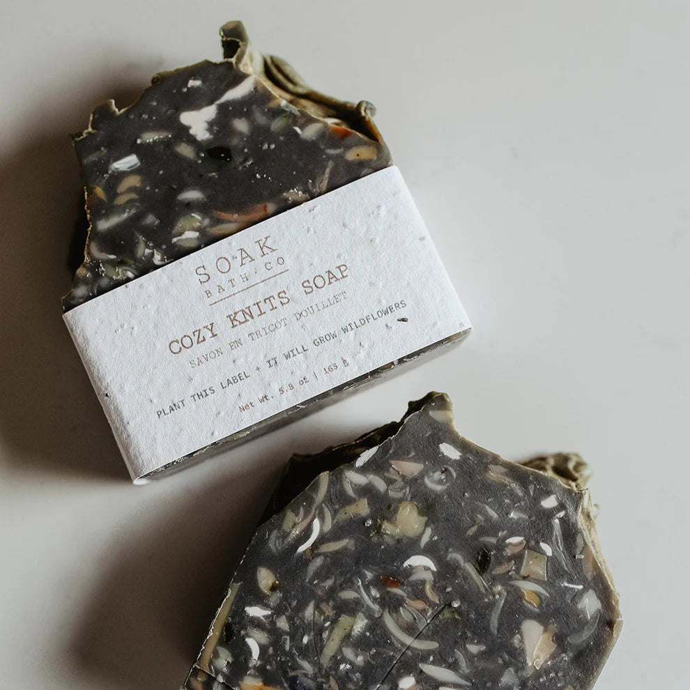 Bar of soap with a visible label on a neutral background