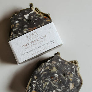 Bar of soap with a visible label on a neutral background
