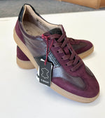 Load image into Gallery viewer, Pair of maroon sneakers on a white surface
