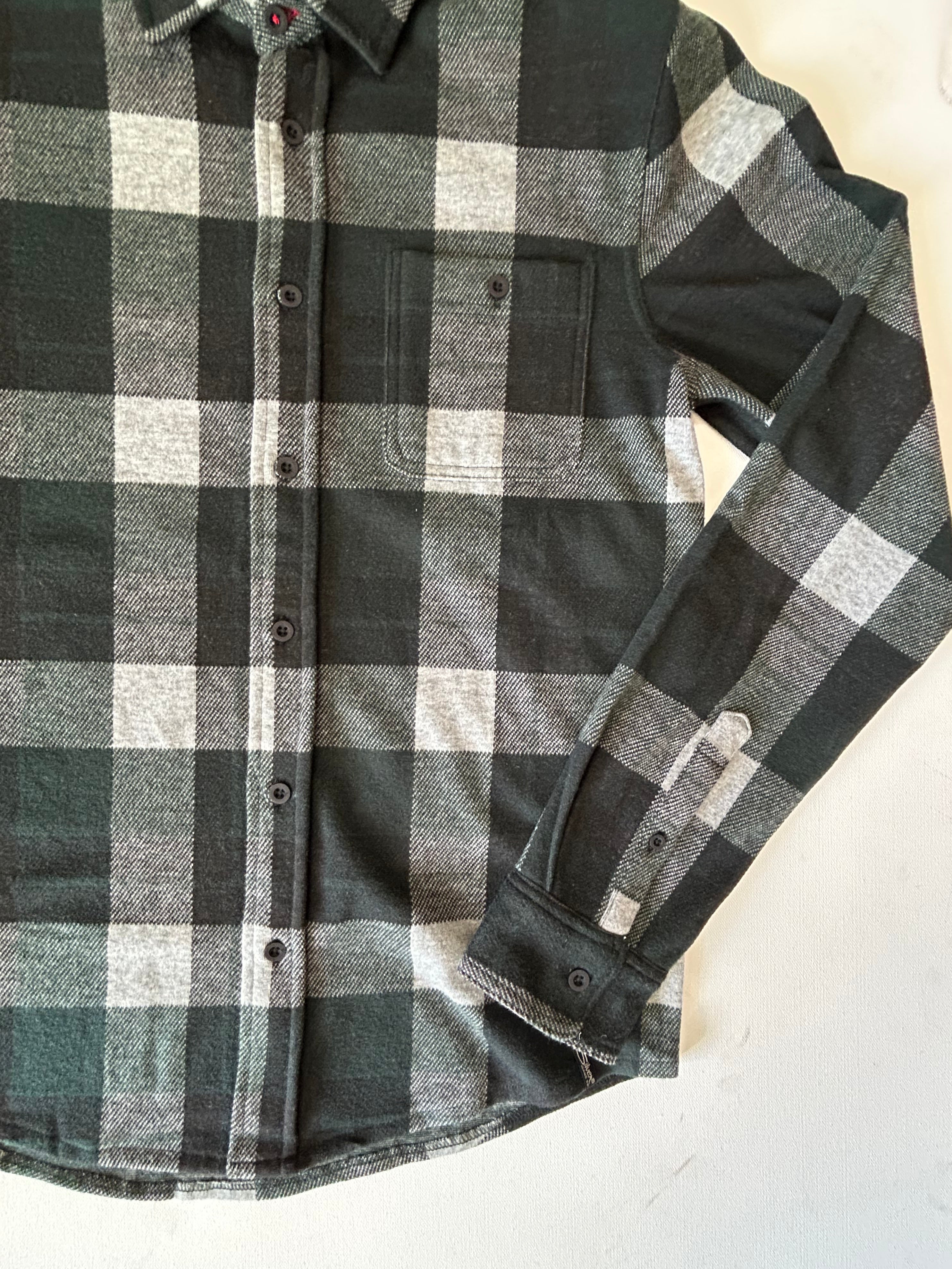 Plaid shirt with olive and grey pattern on a white background