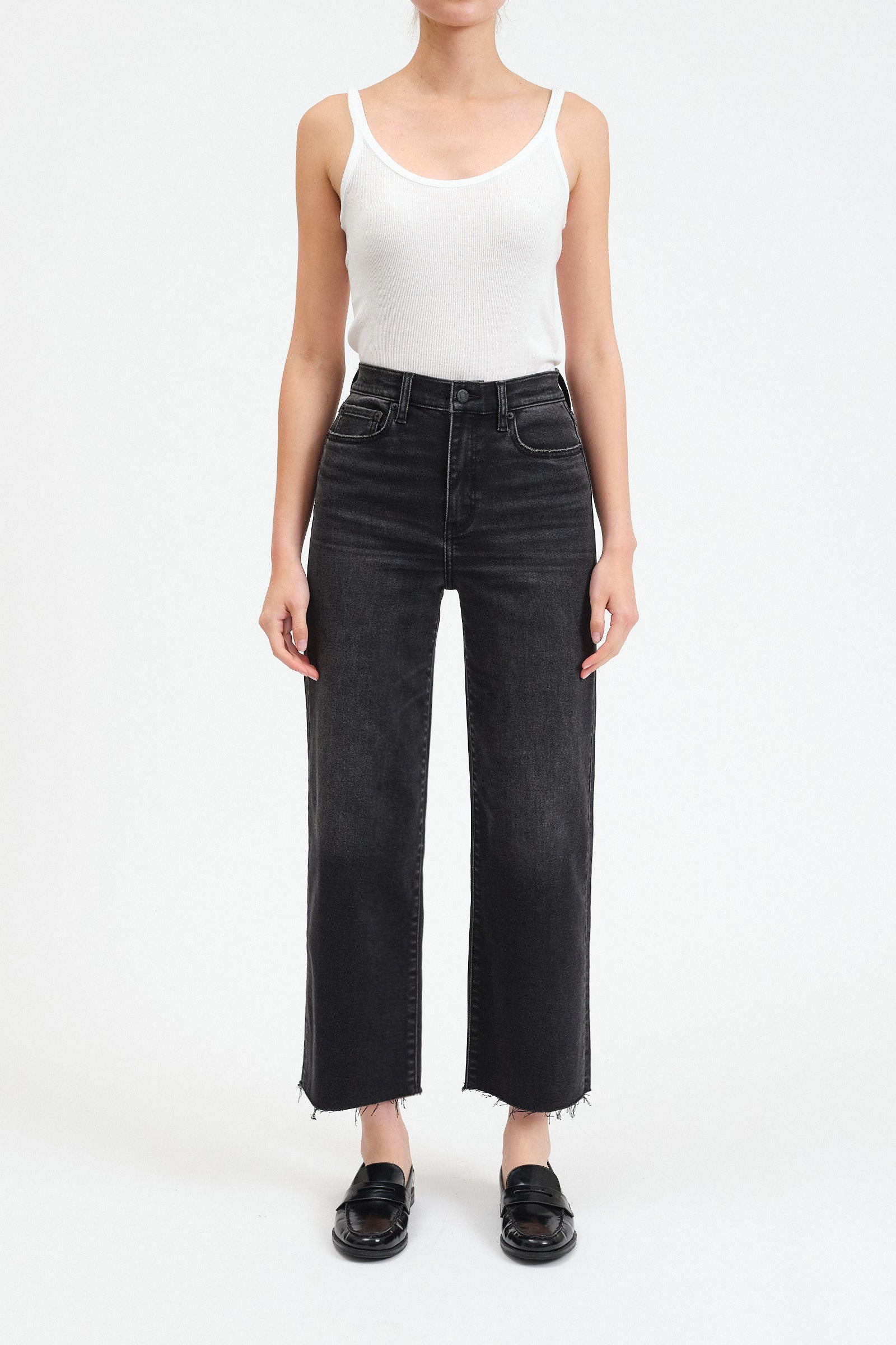 Black high waisted, wide jeans. Ankle length with raw hem. 