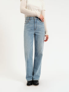 Denim jeans with a high waist, straight legs, and finished hem. 