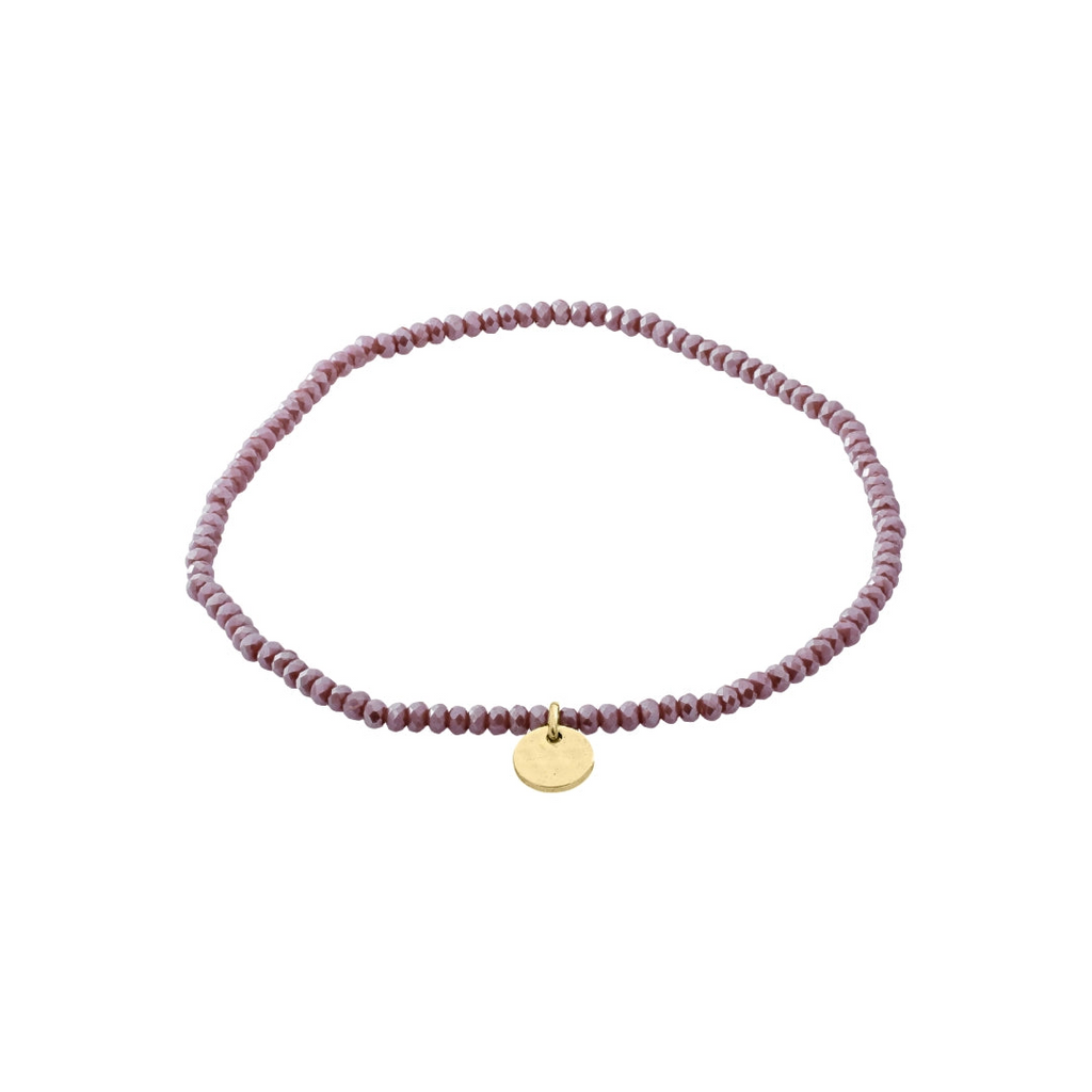 Purple beaded bracelet with a gold tag on a white background