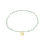 Load image into Gallery viewer, Aqua beaded bracelet with a gold charm on a white background

