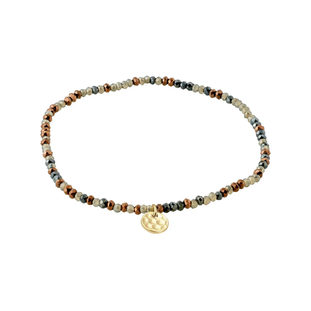 Beaded bracelet with a gold charm and grey and brown beads. 