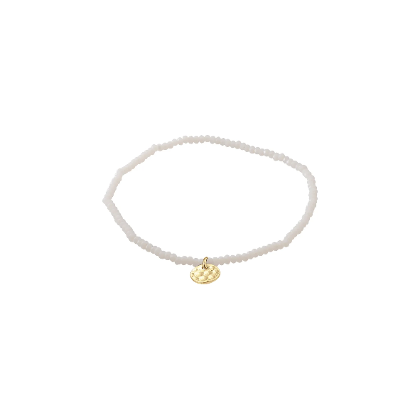White beaded bracelet with a gold charm on a white background