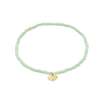 Load image into Gallery viewer, Lime green beaded bracelet with a gold charm on a white background
