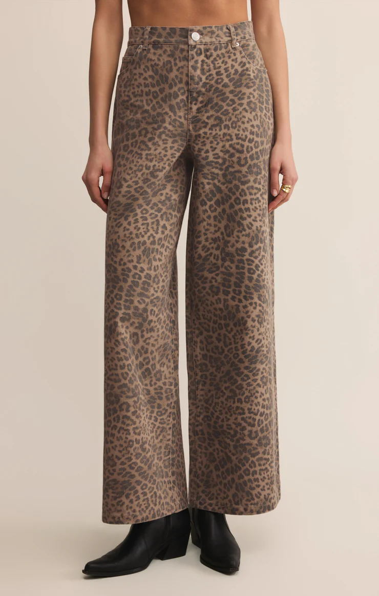Leopard print high-rise jeans featuring a full-length wide leg and utility-inspired five-pocket styling.