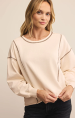 Load image into Gallery viewer, Beige French Terry sweatshirt with dropped shoulders and round neckline. 
