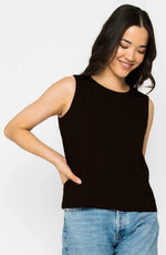 Load image into Gallery viewer, Woman wearing a black sleeveless top and blue jeans on a white background
