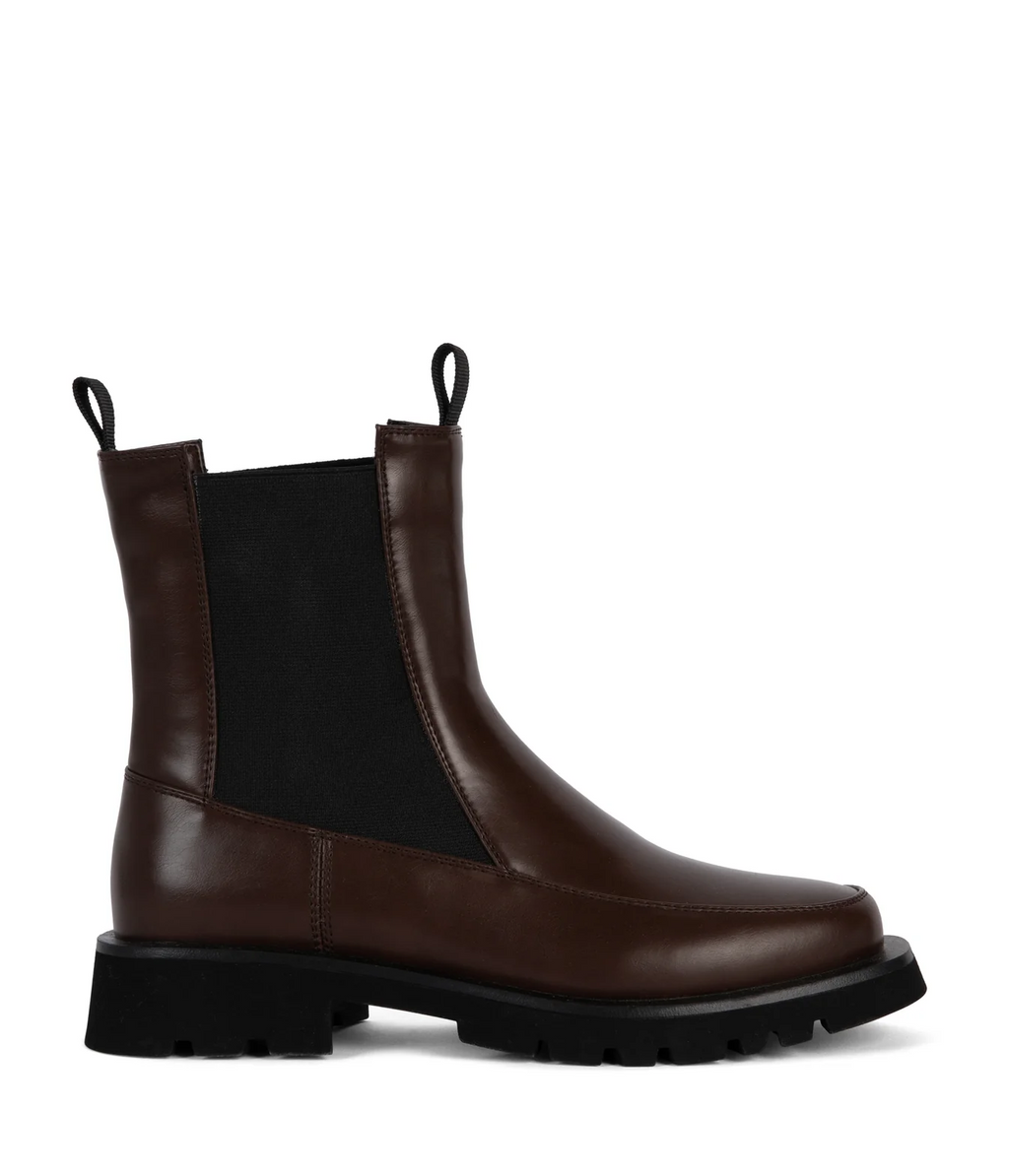 Brown vegan leather Chelsea boot with black sole on a white background