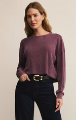 Load image into Gallery viewer, Woman wearing a merlot thermal waffle sweater and black jeans against a beige background
