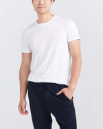 Load image into Gallery viewer, Person wearing a white short sleeve crewneck undershirt. 
